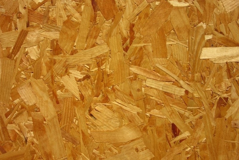 a close up of some chipboard wood - great for insulating a shed