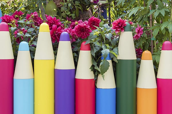 a multi-coloured, pencil-shaped fence