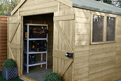 a shed with a shelving unit inside