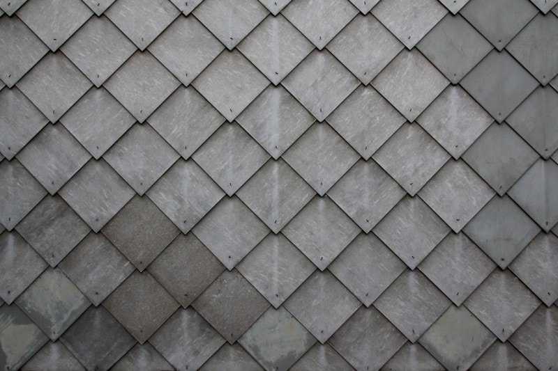 a roof formed of diamond-shaped slate tiles