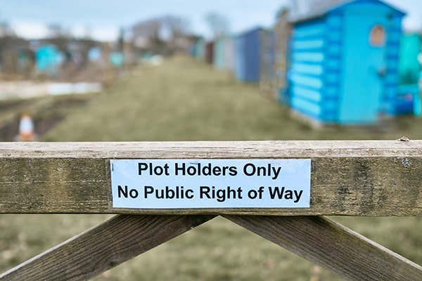 a sign on an allotment fence saying plot holder only