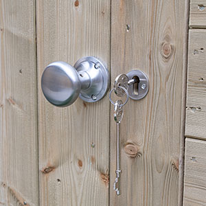 a shed door with handle and key-operated lock