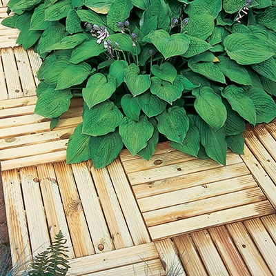 ridged decking tiles around a plant