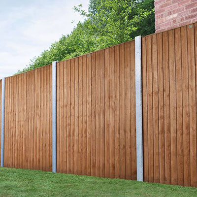 a fence run made up of closeboard panels and concrete fence posts