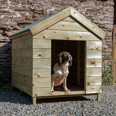 a dog inside a wooden dog kennel