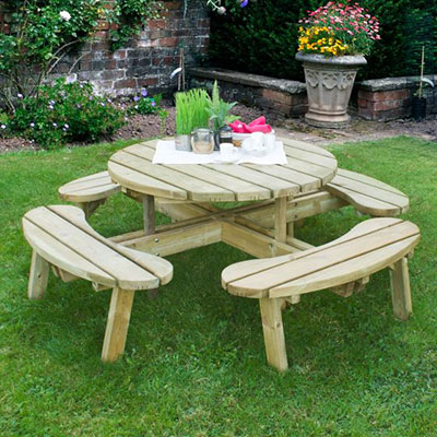 a circular wooden garden picnic table