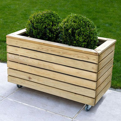 a wooden garden planter with wheels