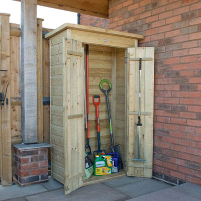 a tall, wooden tool shed containing long-handled tools