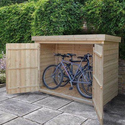 a wooden garden storage unit used as a bike shed