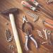 a collection of neatly laid out tools - helpful for building a slate roof