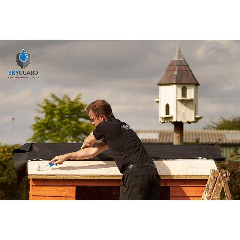 A Person fitting a SkyGuard Roofing Kit to a Shed