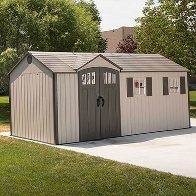 An attractive plastic shed with double doors and charming windows