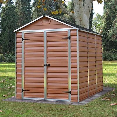 A reddish brown plastic shed with an apex roof and double doors