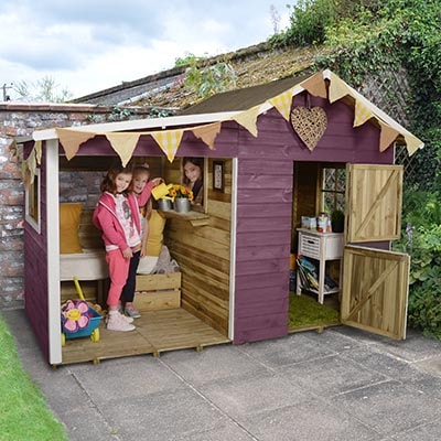 a wooden playhouse with large side covered space