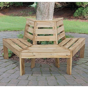 The Forest Timber Garden Tree Seat, positioned on a patio, around a tree trunk.
