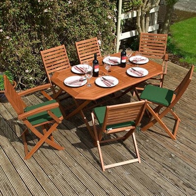 a wooden garden dining table and 6 matching chairs