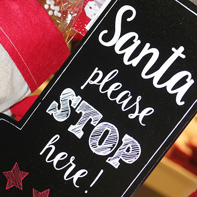 a sign saying 'Santa please stop here'