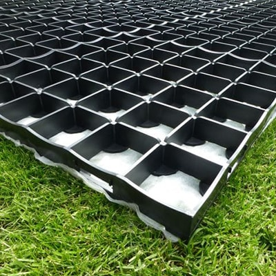 a black plastic shed base with interlocking grids