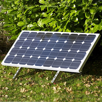 a solar panel positioned on a lawn