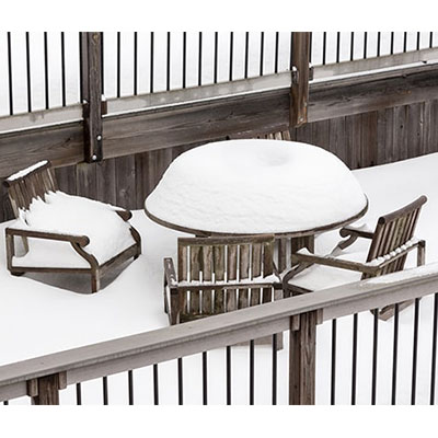 garden furniture covered in snow